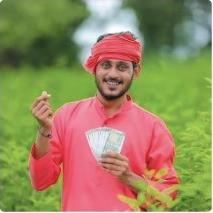 Farmer holding earned money in a field